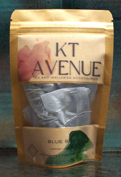 KT Avenue tea package with visible tea bags inside on a reflective surface.