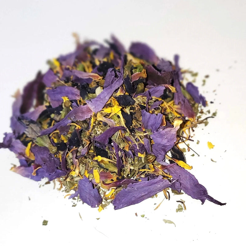 Heap of dried purple and yellow flowers on a white background