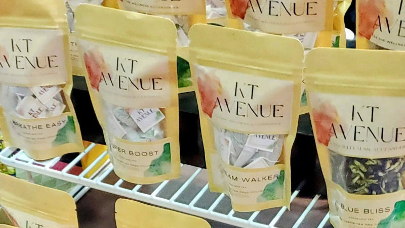 KT Avenue tea packages on a display rack