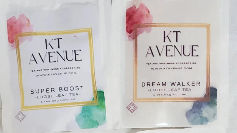 Two KT Avenue tea bags with floral designs on a white background